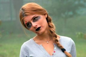 blonde girl with halloween makeup f or