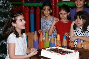 kids at a party with cake