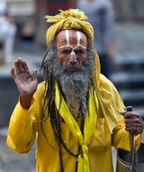 guru in yellow robes in Nepal