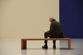 Man Read on Bank