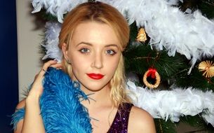 blonde with red lips in blue Christmas tinsel