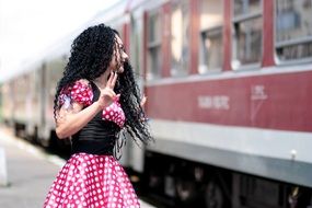 woman saying goodbye to the train