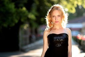 elegant blonde in black dress