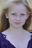 portrait of a pretty young girl with blond long hair