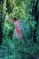 levitating young woman in the magic forest