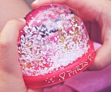 souvenire from Paris in childâs hands