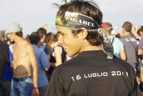 cheerful guy at an open-air concert