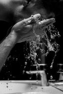 man washes water