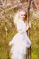 blond-haired woman in the spring garden