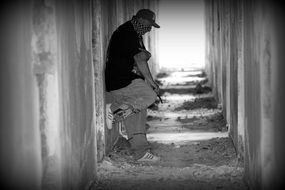 gangster with pistol in black and white