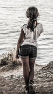 Lonely child girl on beach
