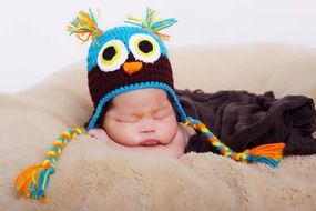 baby in a funny knitted hat