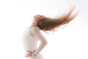 model with long hair posing in white clothes