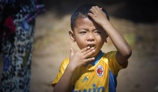 child in sports uniform in cambodia
