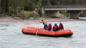 people sail to meet adventures in a rubber boat