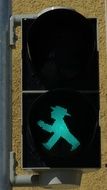 green sign at traffic light