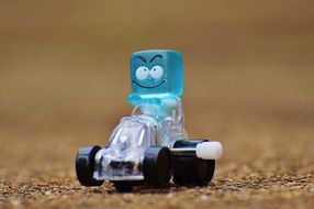 toy in the form of a blue square on the race car
