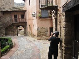 photographer in the alley of the old city