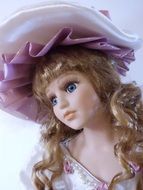 beautiful doll in a pink hat