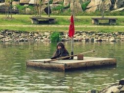 boy on a homemade raft