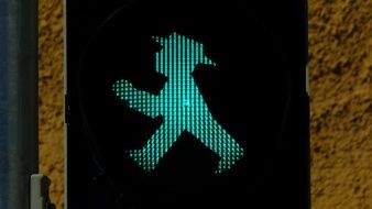 man at the traffic light as a light sign