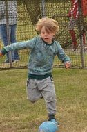running boy with ball