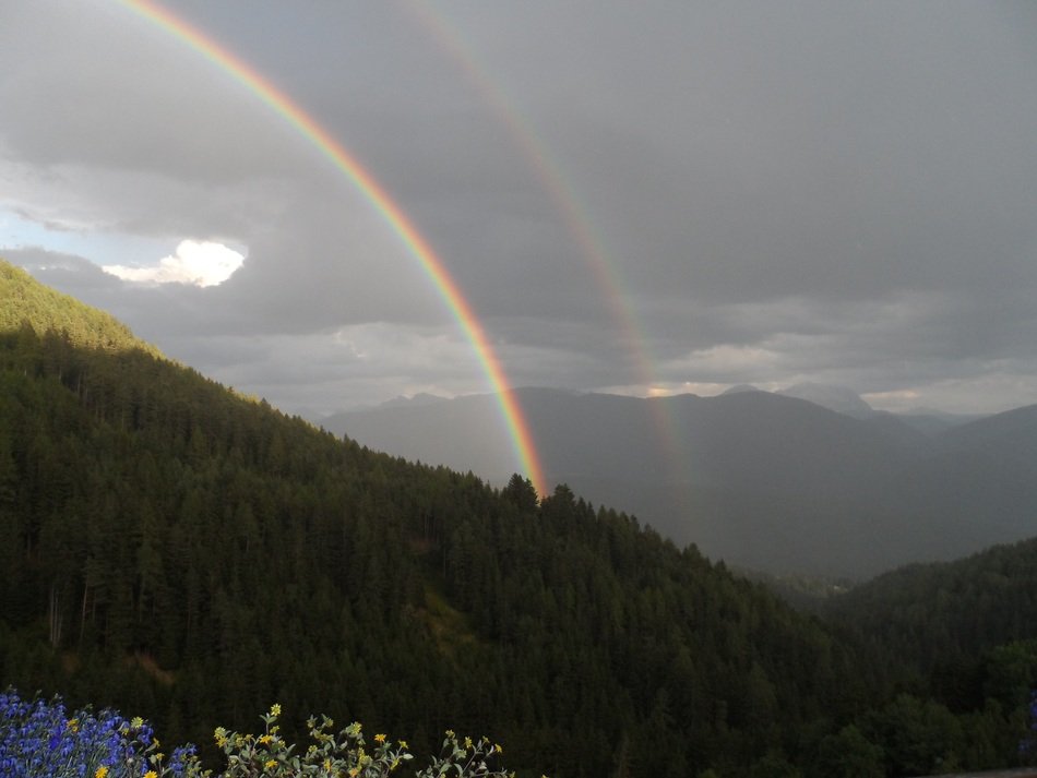 double rainbow over the picturesque mountains