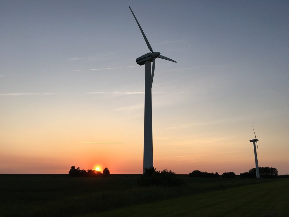 windmills on the field at dusk