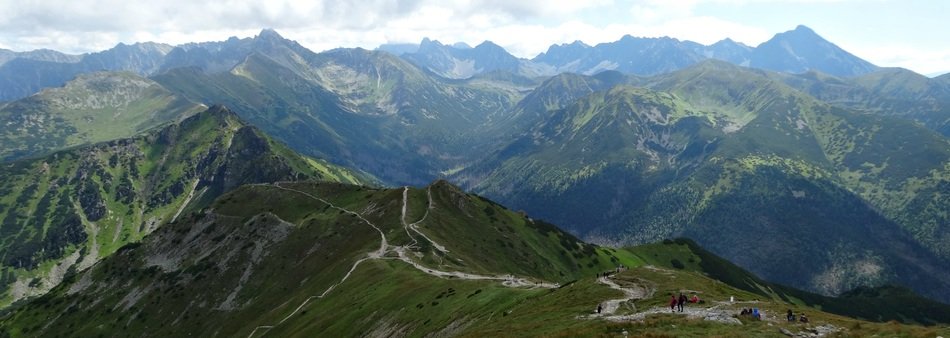 trails on the tops of green mountains