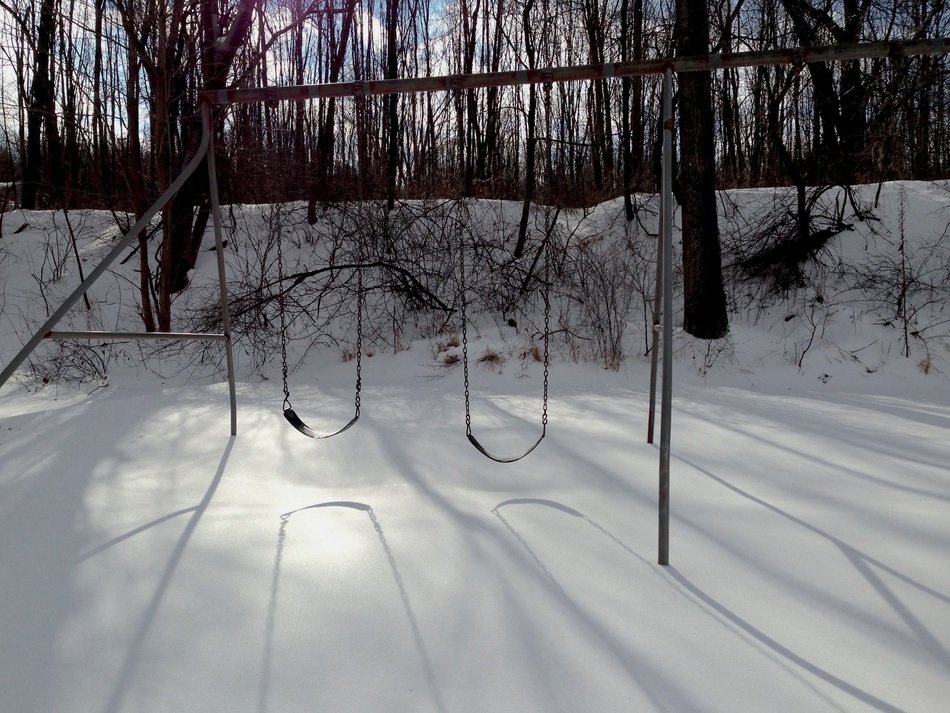 Swing on the playground in winter