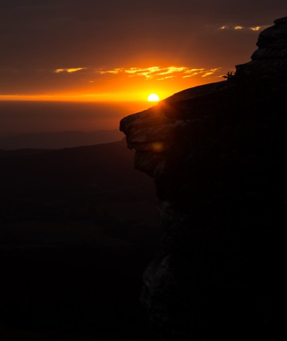 Cliff on the background of the sunset