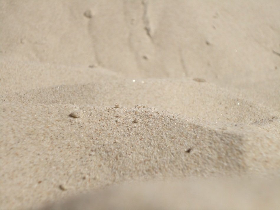 A lot of the sand on the beach in summer