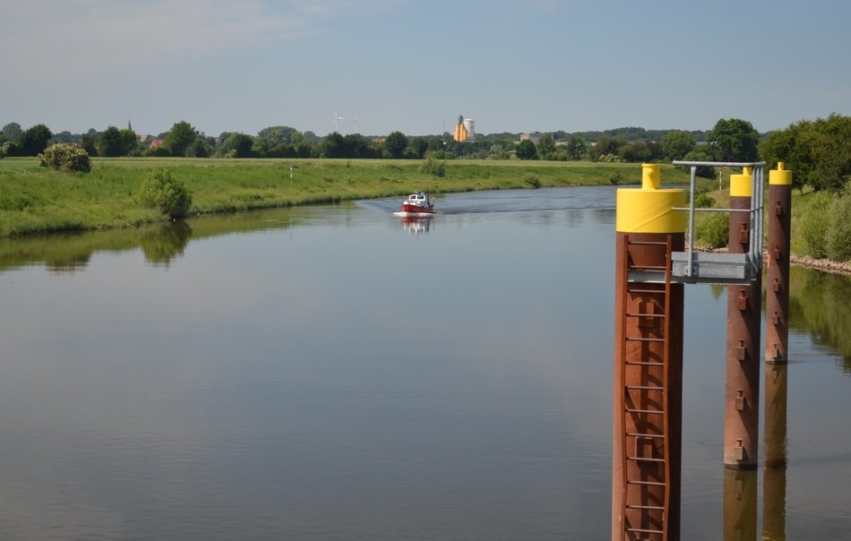 Boat on the beautiful Weser river among the plants in Germany