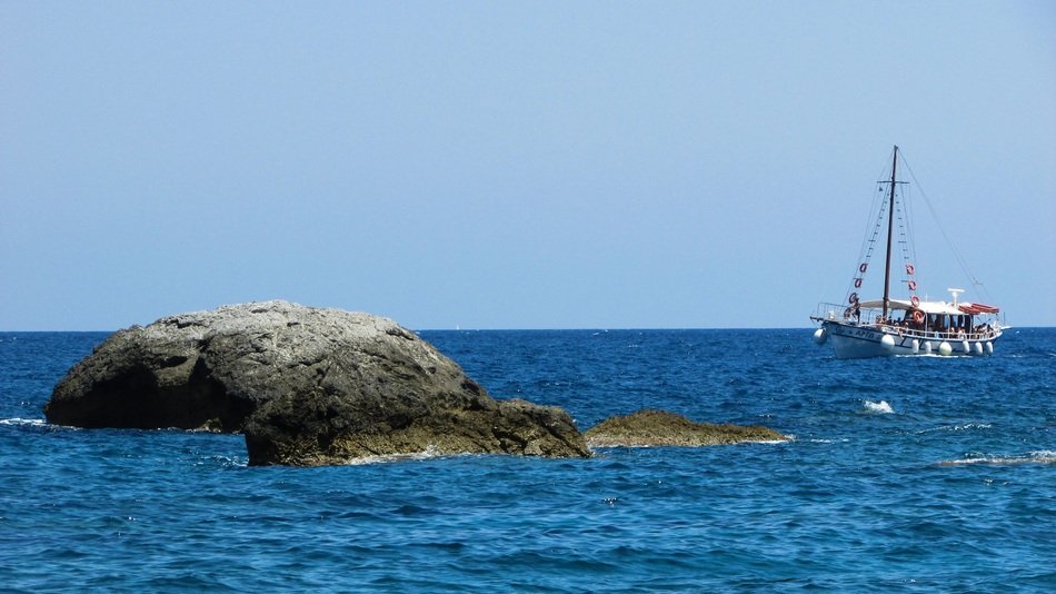 touristic boat near kastro in skiathos on a sunny day