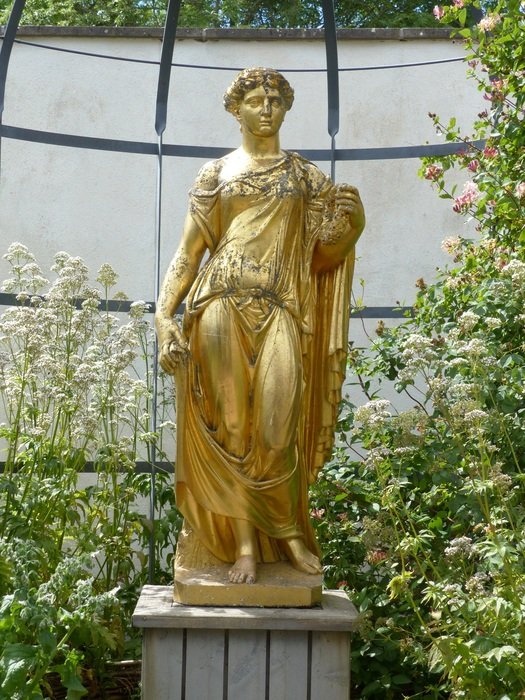 golden statue in the botanical garden