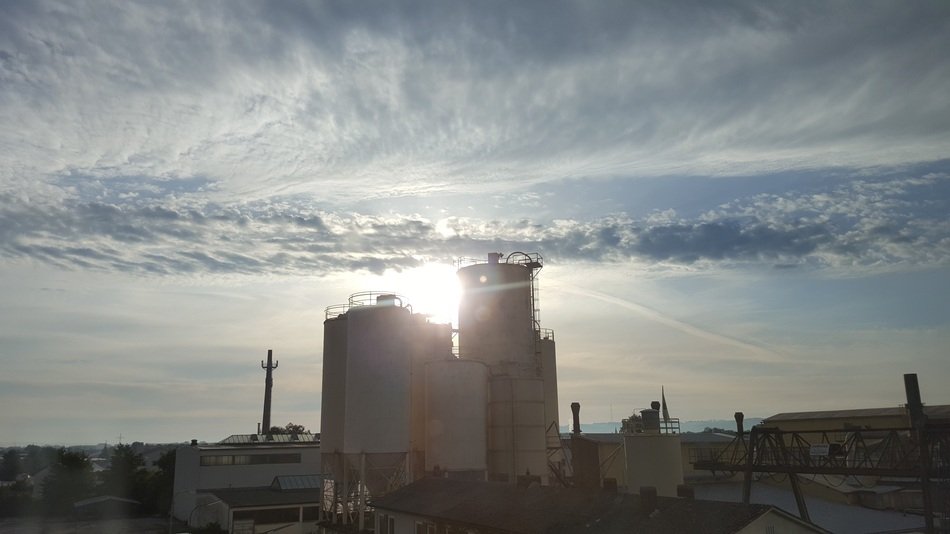 Landscape of the city and sunrise in the clouds