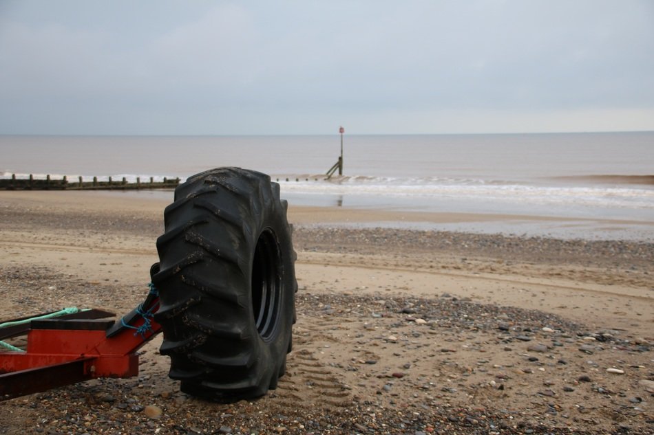 big tire on the beach