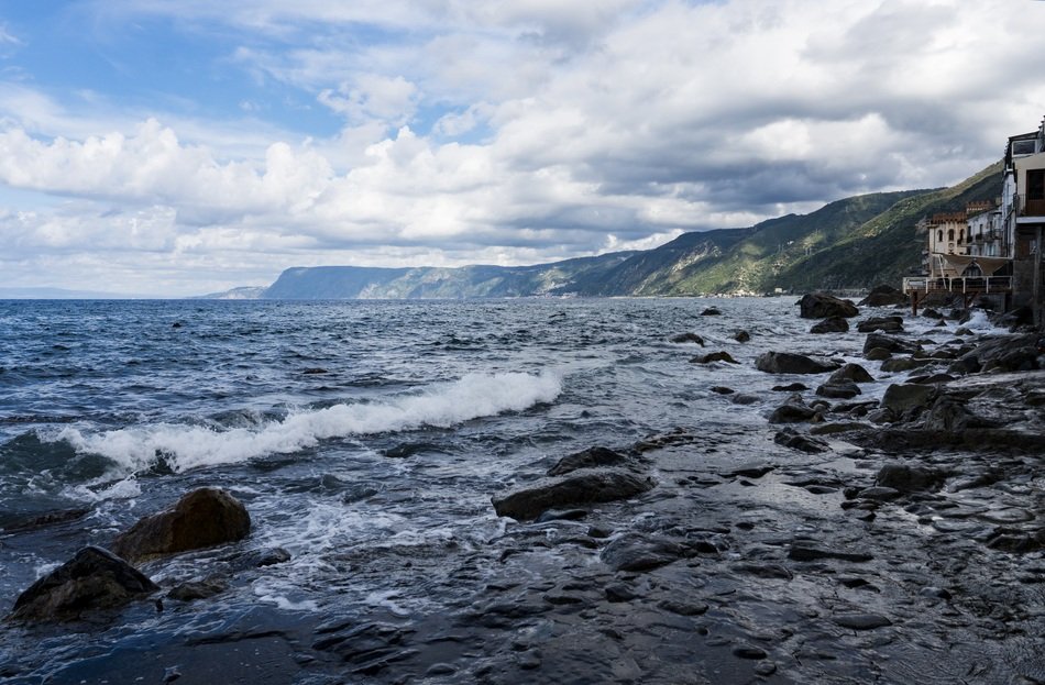 Stones near the hills on the coast of Italy in Calabria