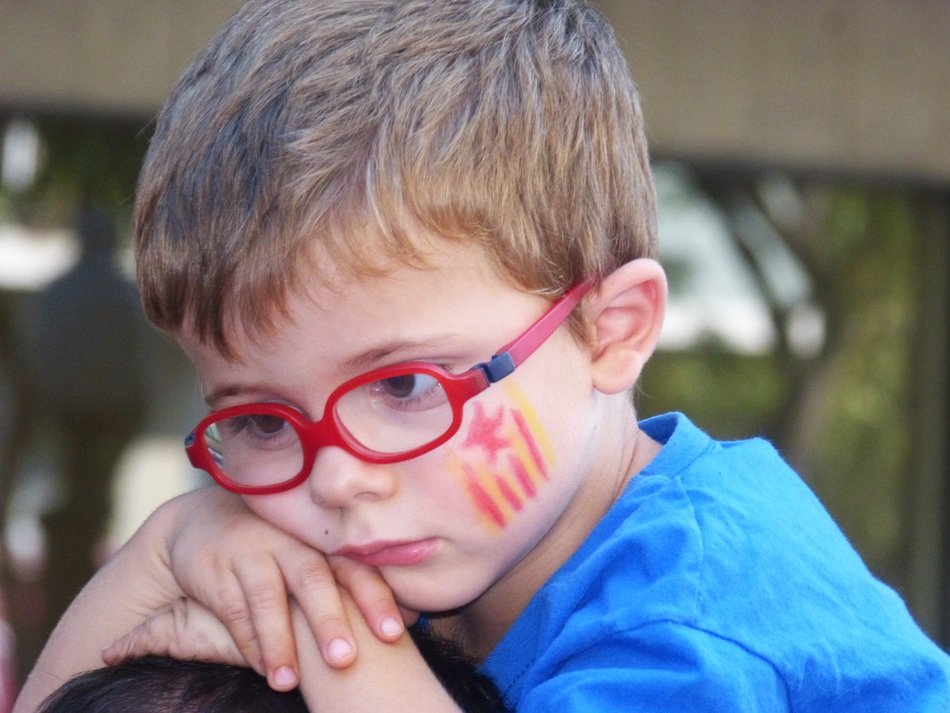 tired child with glasses