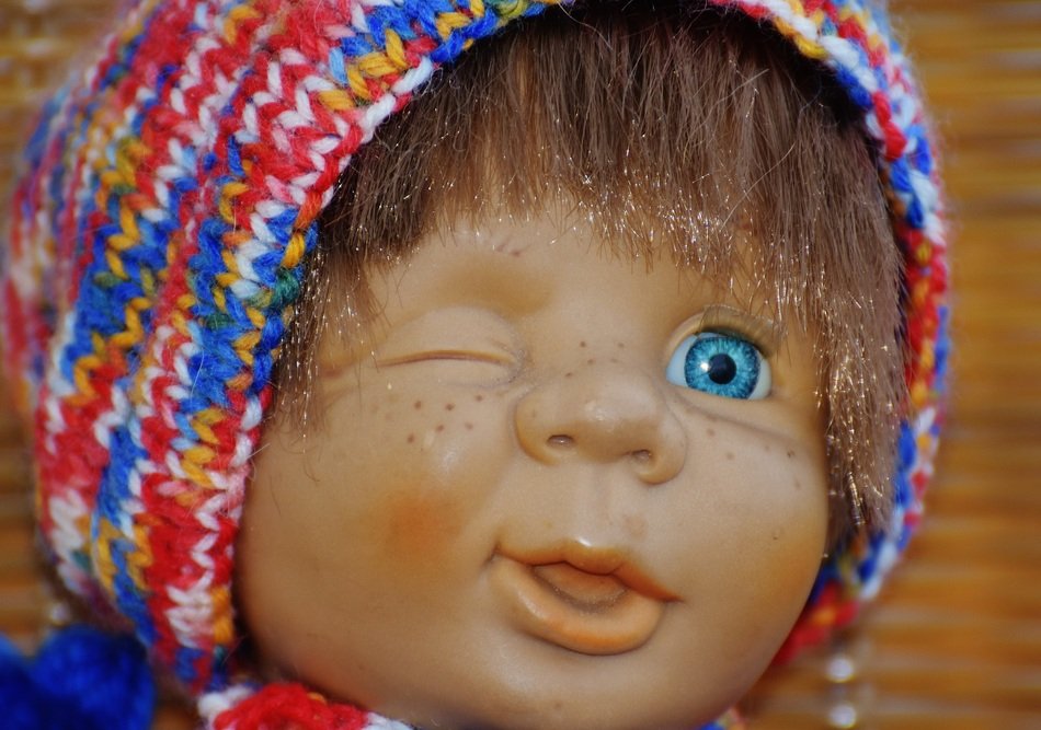 head doll in a scarf and with one eye