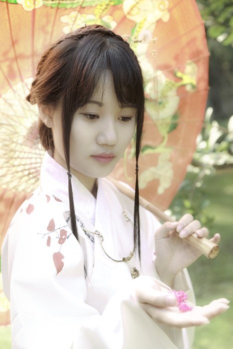Chinese girl with umbrella in hand