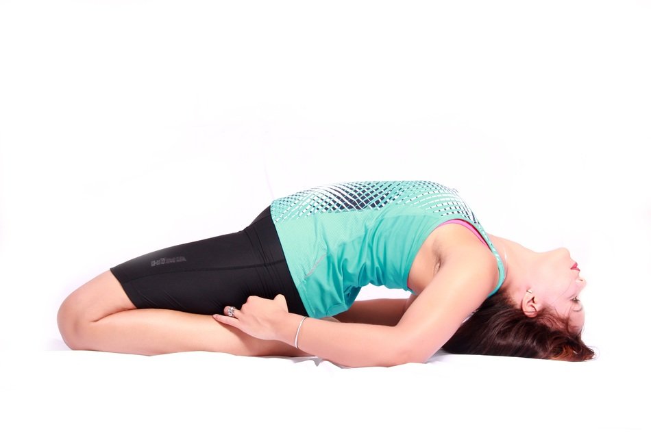 girl on the back in yoga pose