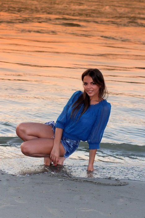 beautiful brunette on the evening beach