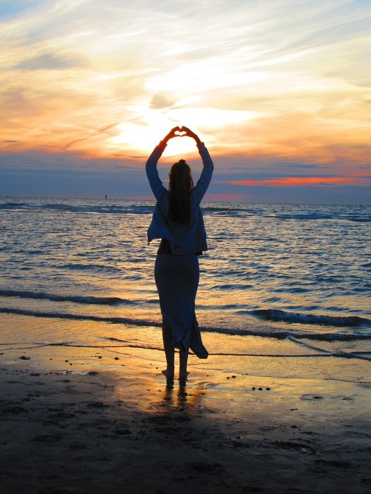 girl posing on a sunset background