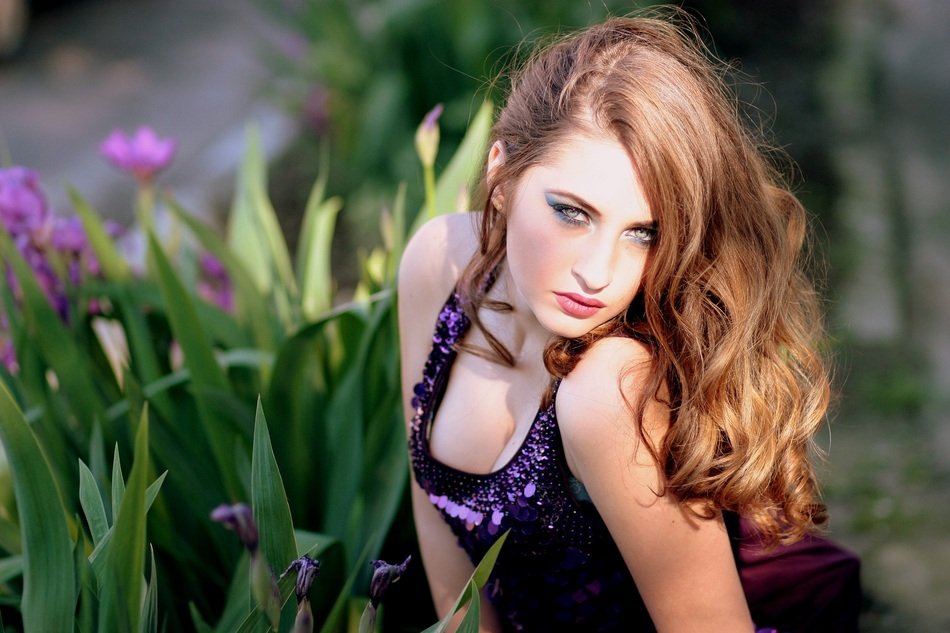 pretty model posing in the flower garden