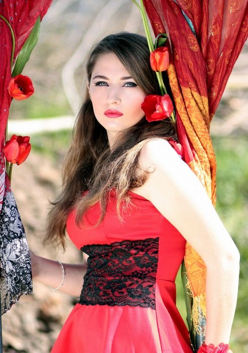 girl with beautiful eyes in a red dress