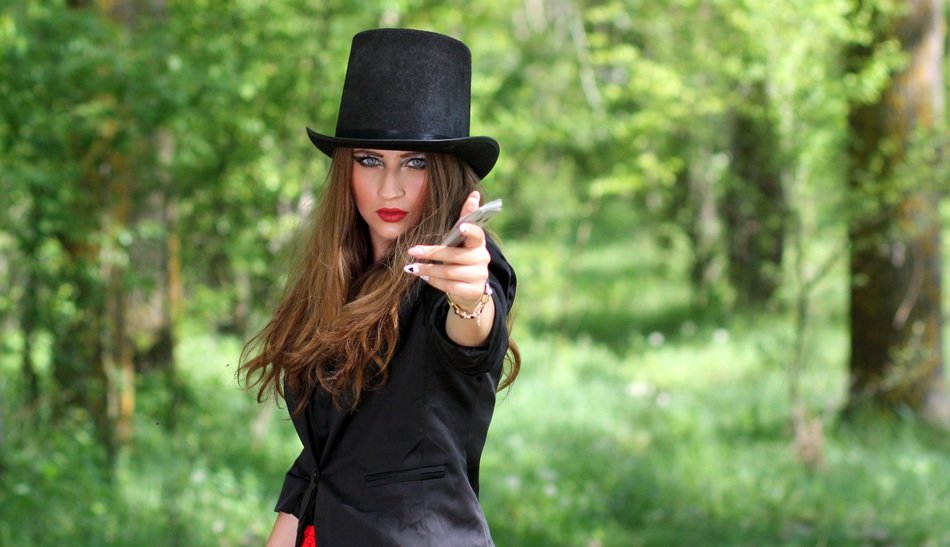 model in topper with playing cards