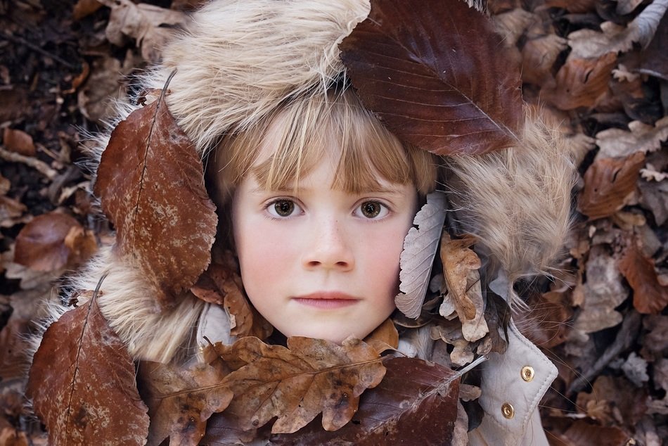 Portrait of a girl among the leaves