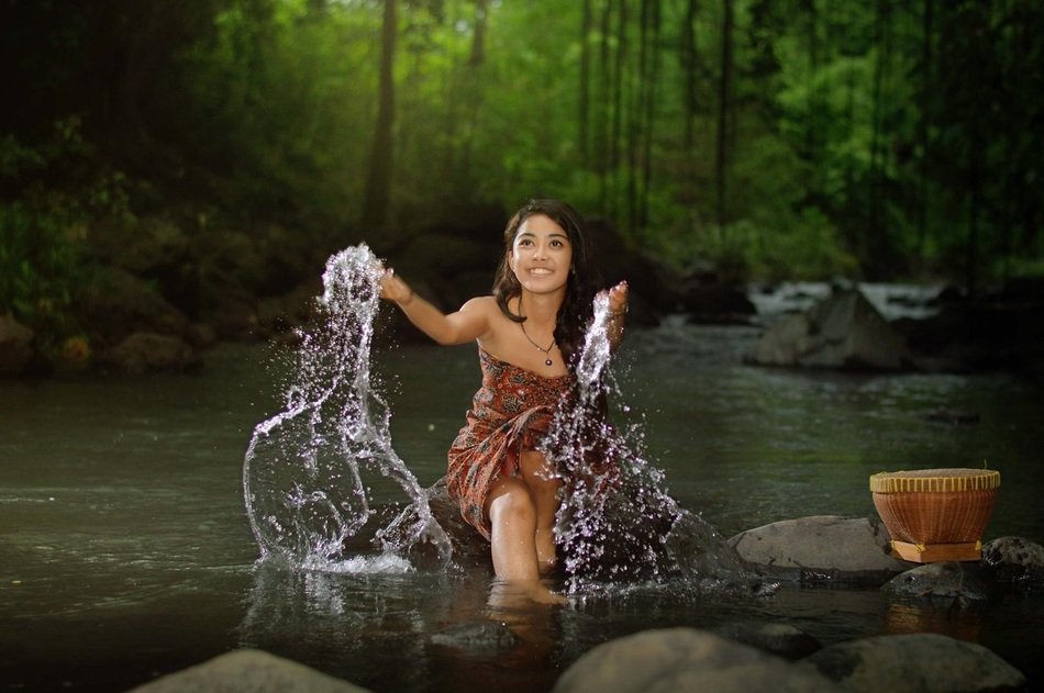 beautiful girl in spray of water