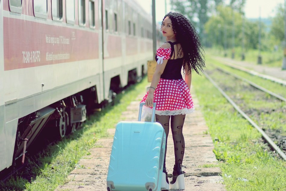 girl with suitcase on the platform